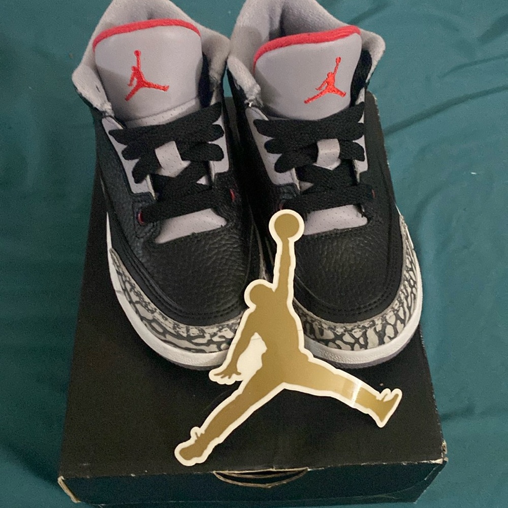 Gently used Jordan Nikes for children gray black and red color